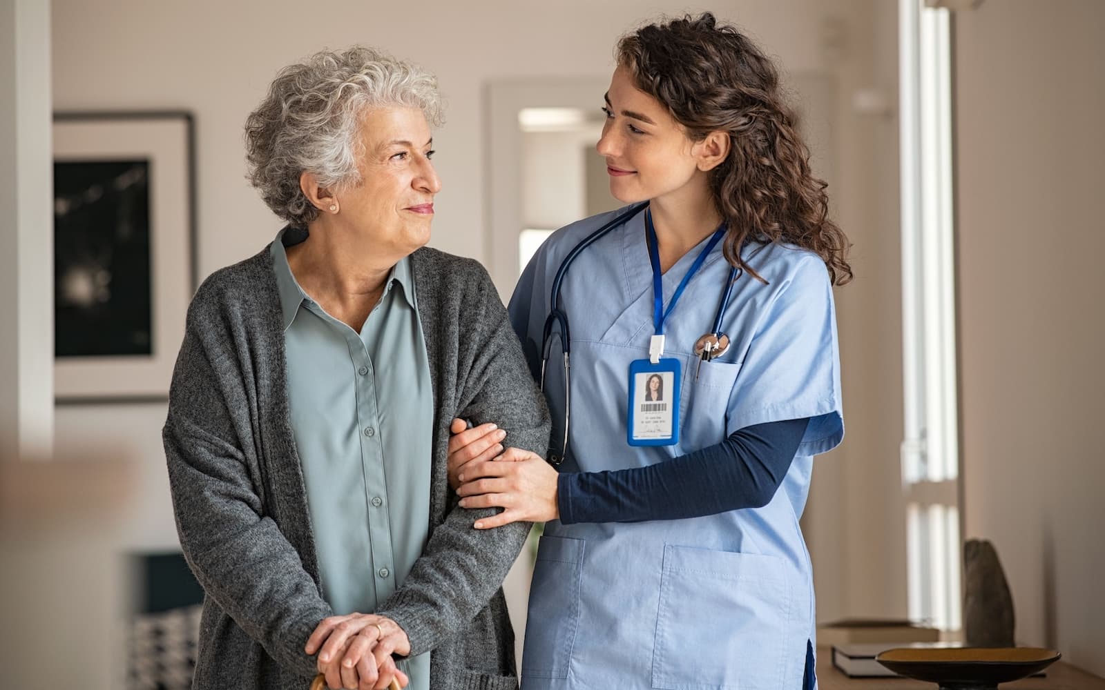 Nurse assisting a senior woman